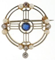Art Deco unmarked two tone gold brooch set with five diamonds, sapphire and six seed pearls, the