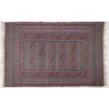 Rectangular Afghan red ground rug having an allover geometric design within corresponding borders,