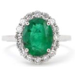 18ct white gold emerald and diamond cluster ring with certificate, total diamond weight