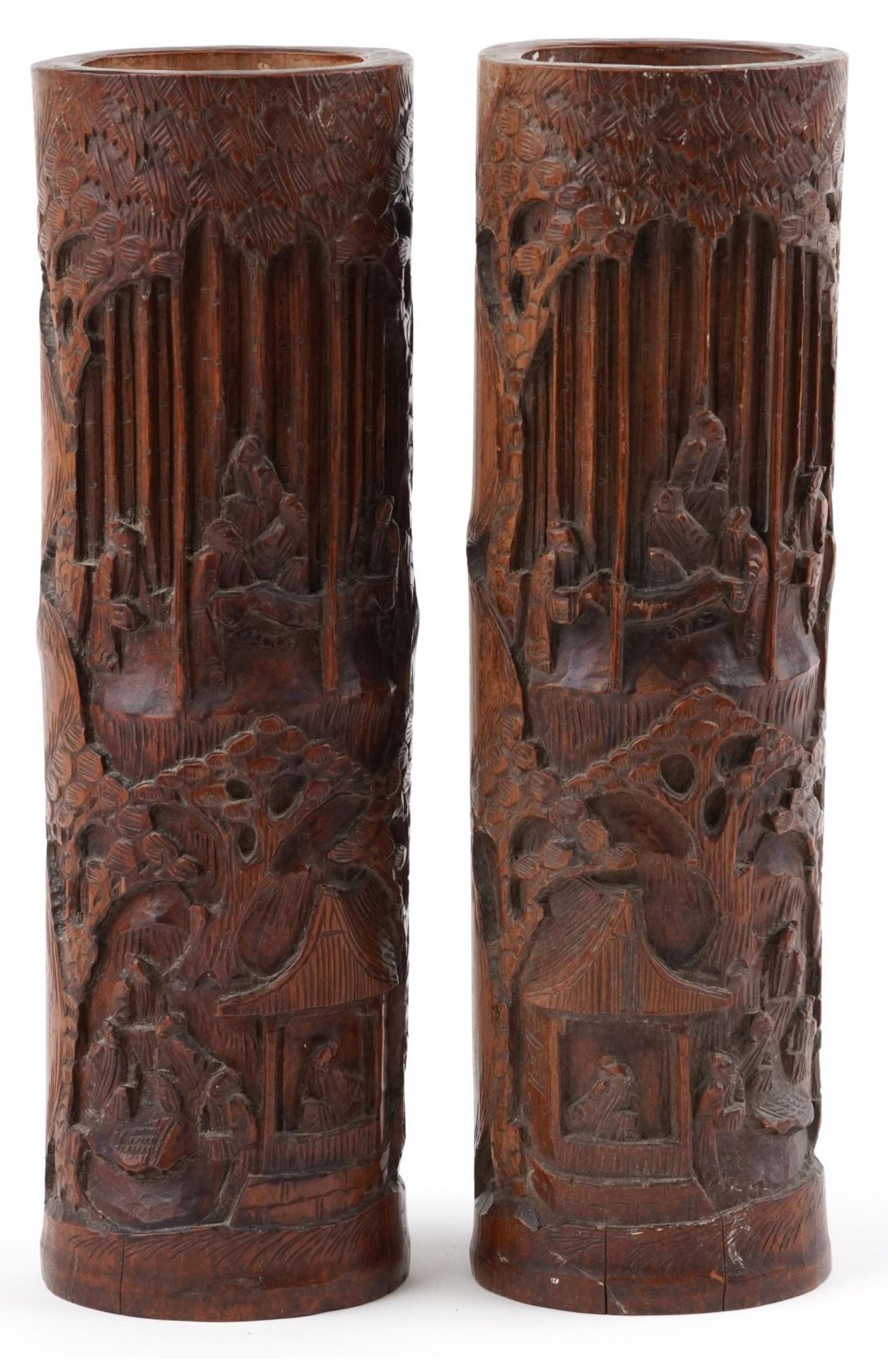 Pair of Chinese cylindrical bamboo vases carved with figures amongst trees and pavilions, each
