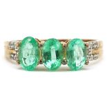 9ct gold emerald three stone ring with white spinel set shoulders, size N, 2.0g