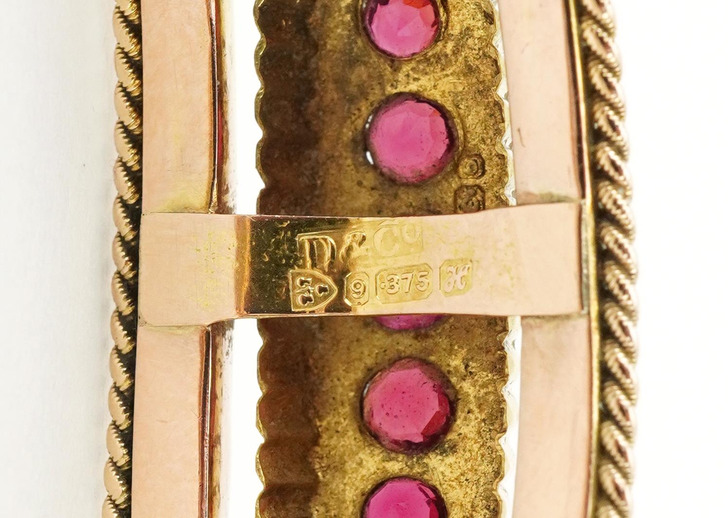 Edwardian 9ct rose gold hinged bangle set with eleven graduated red stones and seed pearls, - Image 3 of 4