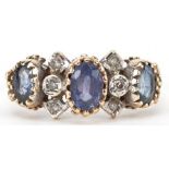 9ct gold sapphire and diamond cluster ring, the largest sapphire approximately 6.60mm x 4.70mm x 2.