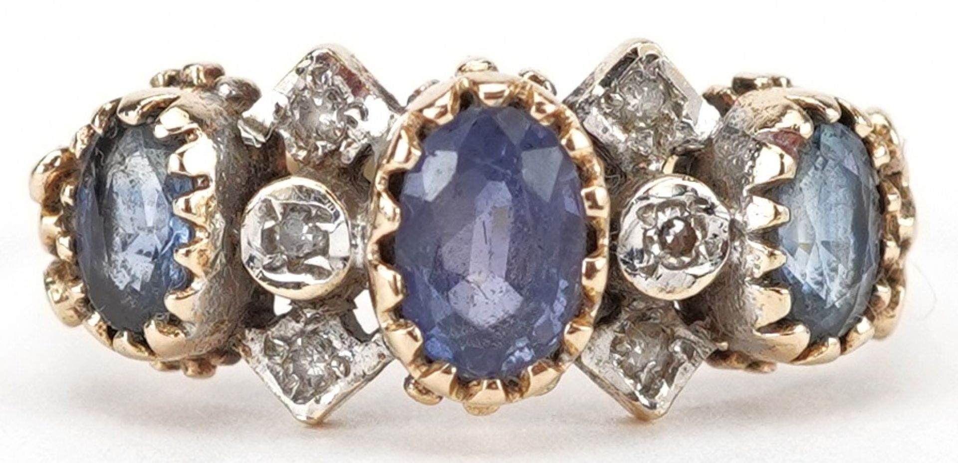 9ct gold sapphire and diamond cluster ring, the largest sapphire approximately 6.60mm x 4.70mm x 2.