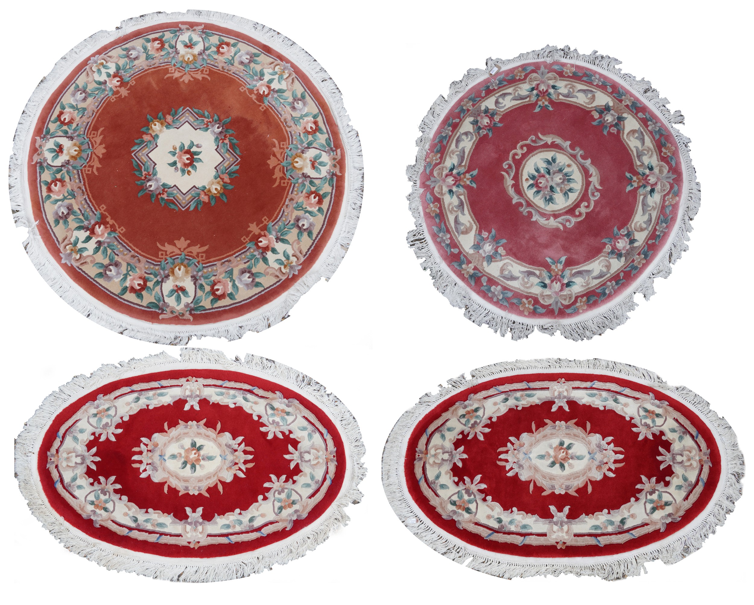 Four Chinese floral rugs comprising two circular and an oval example, the largest 167cm in diameter