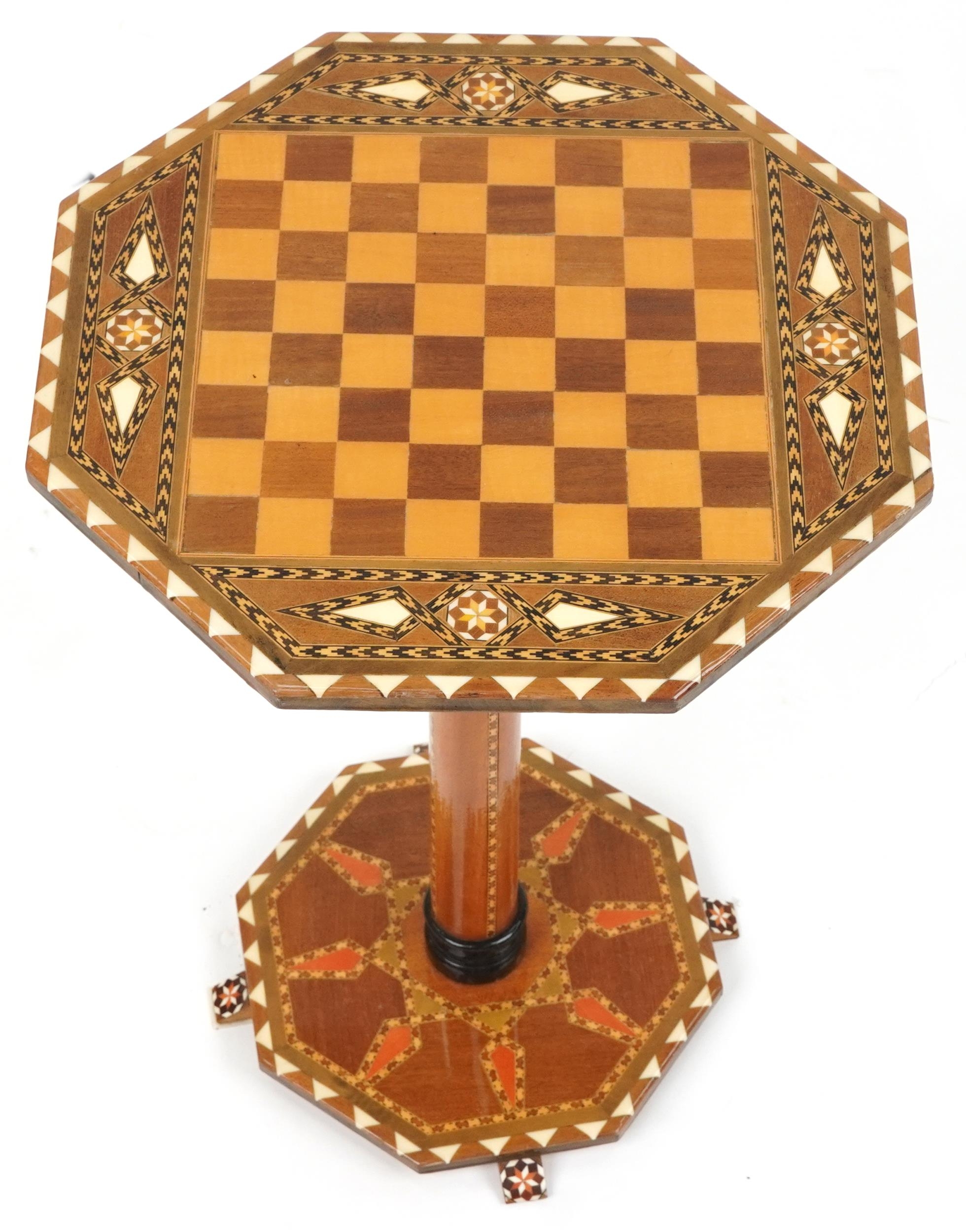 Manner of Liberty & Co, Moorish style inlaid chess occasional table with octagonal top and base, - Image 2 of 3