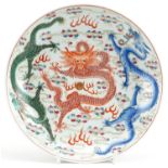 Chinese porcelain shallow dish hand painted in the famille rose palette with dragons chasing the