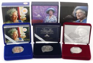 Three Queen Elizabeth II and The Queen Mother commemorative silver crowns by The Royal Mint, with
