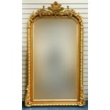 Large ornate gilt framed wall mirror having bevelled glass mounted with flowers and foliage, 220cm x