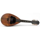 19th century Italian melon shaped rosewood mandolin bearing an L Romito & F Carbone paper label,