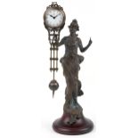 Patinated spelter mystery clock in the form of an Art Nouveau maiden, 33.5cm high
