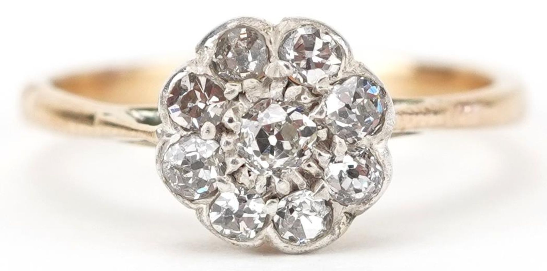 18ct gold diamond flower head cluster ring, total diamond weight approximately 0.26 carat, size K/L,