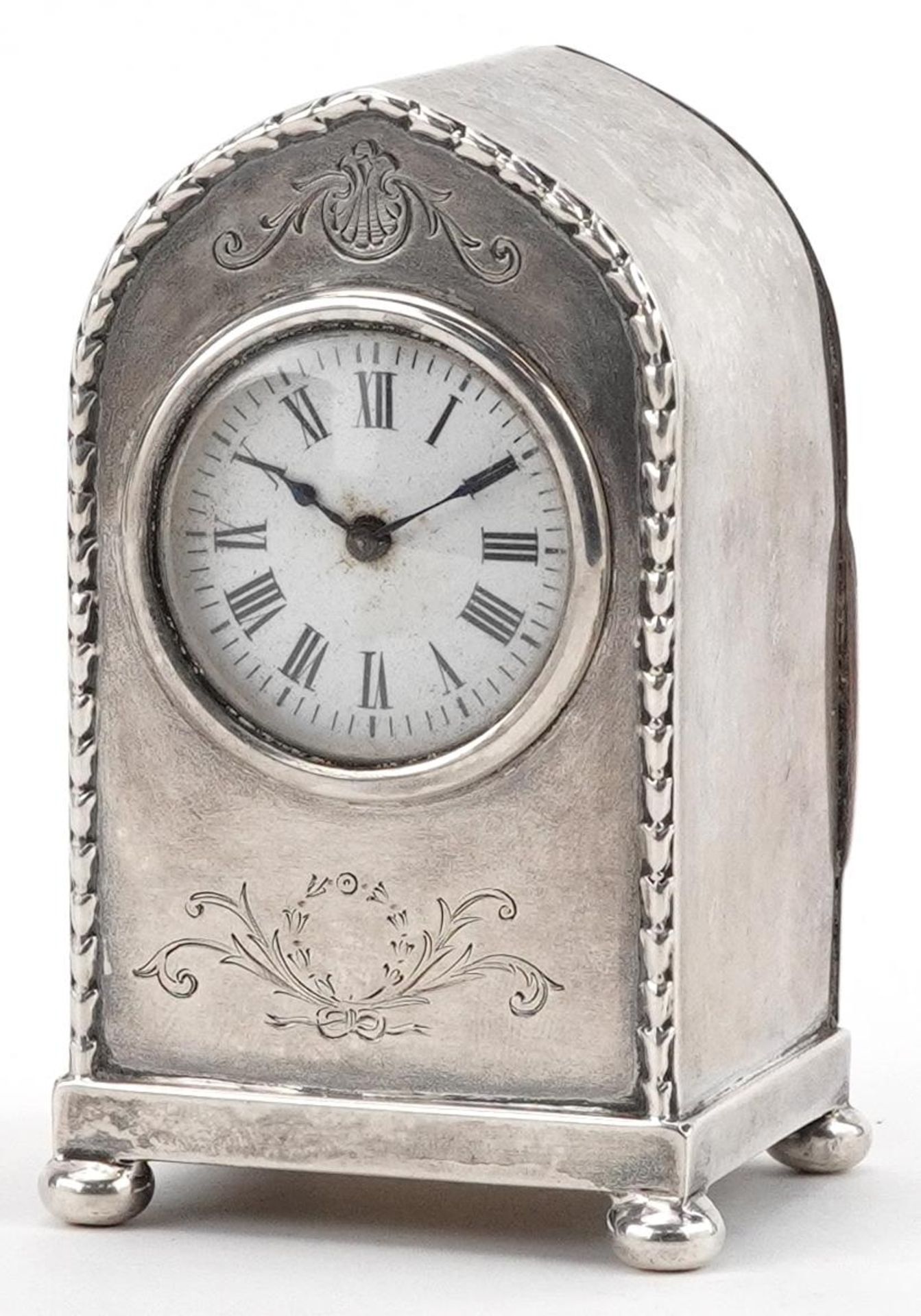 William Comyns & Sons, Edwardian silver arch top carriage clock having enamelled dial with Roman