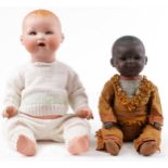 Armand Marseille, two German bisque headed dolls with jointed limbs including an African example,