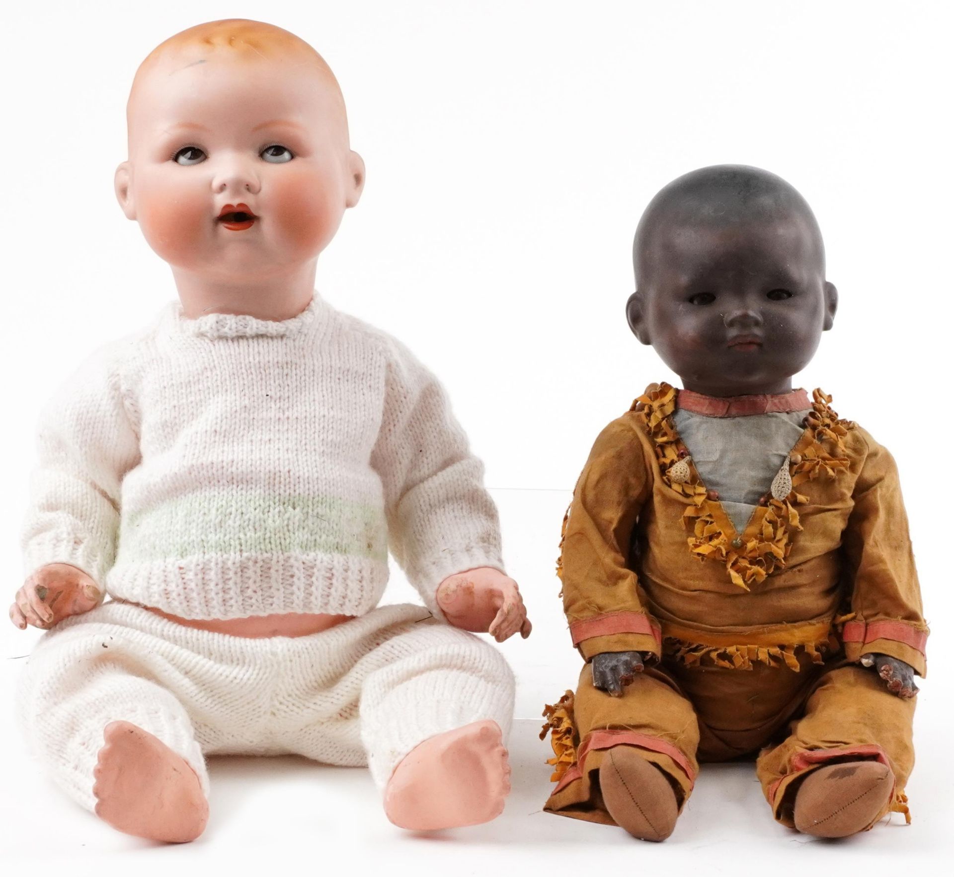 Armand Marseille, two German bisque headed dolls with jointed limbs including an African example,