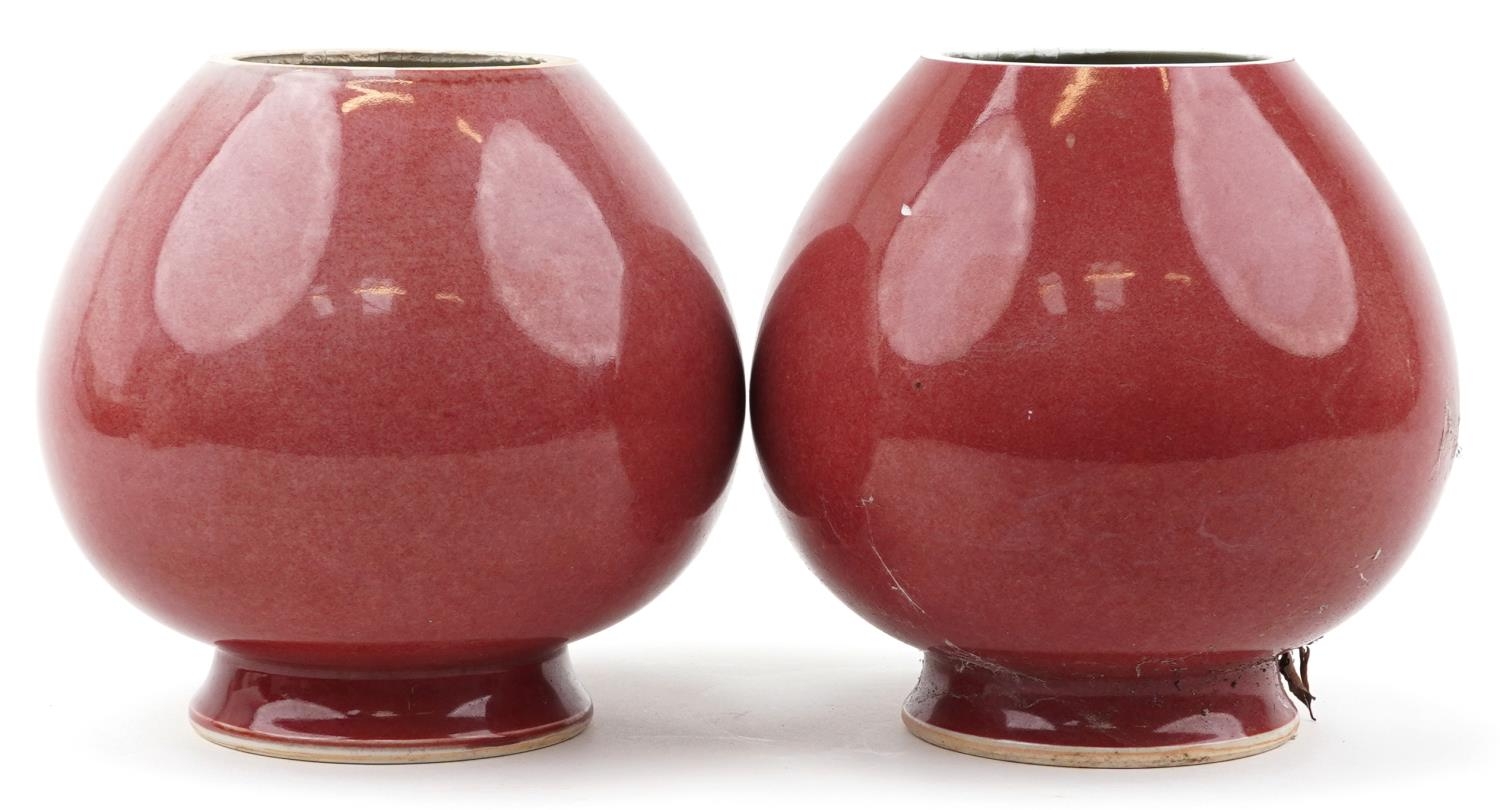 Pair of Chinese porcelain vases having sang de boeuf glazes, six figure character marks to the