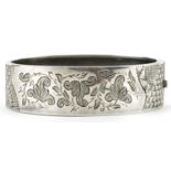 Victorian aesthetic silver engraved hinged bangle, Birmingham 1883, 6.5cm wide, 21.2g