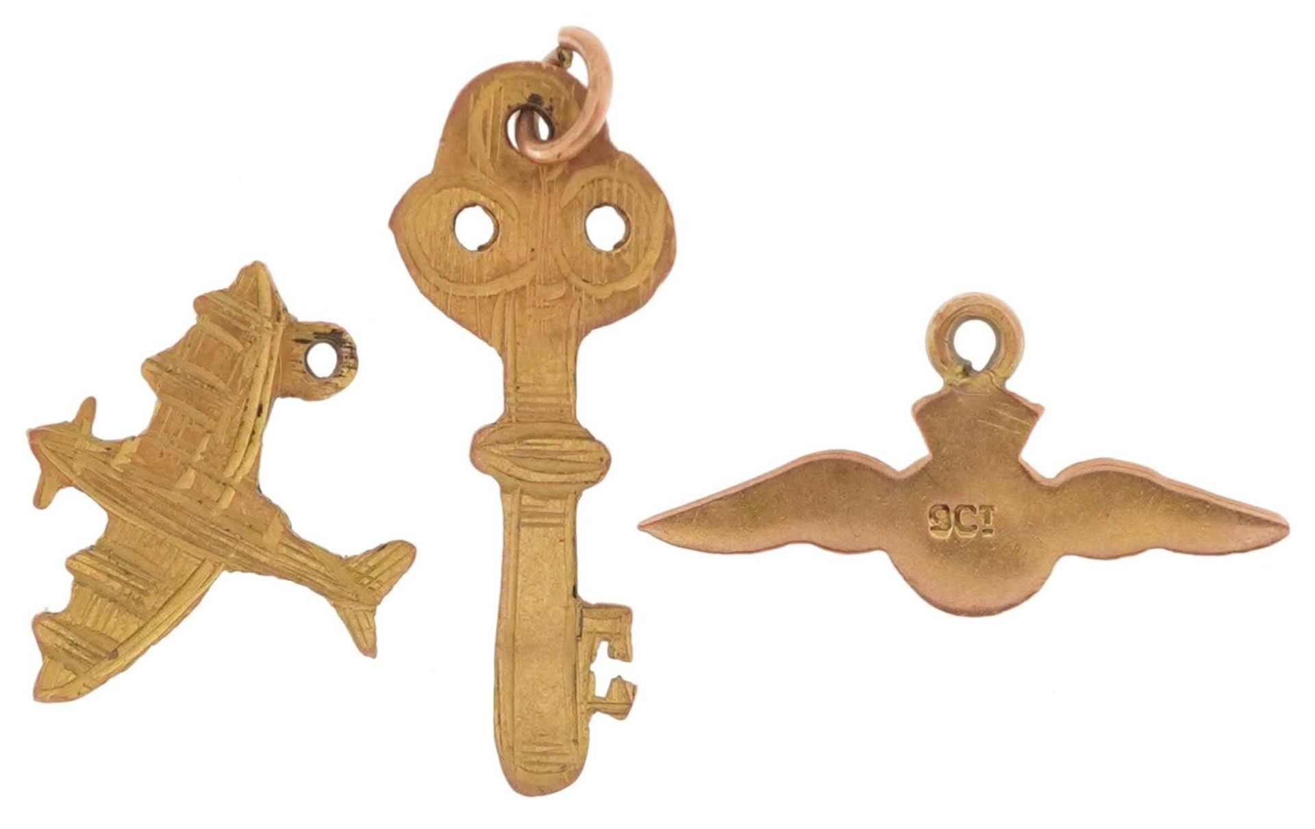 Three 9ct gold charms, some military interest, in the form of RAF wings, aeroplane and key, the - Image 2 of 4