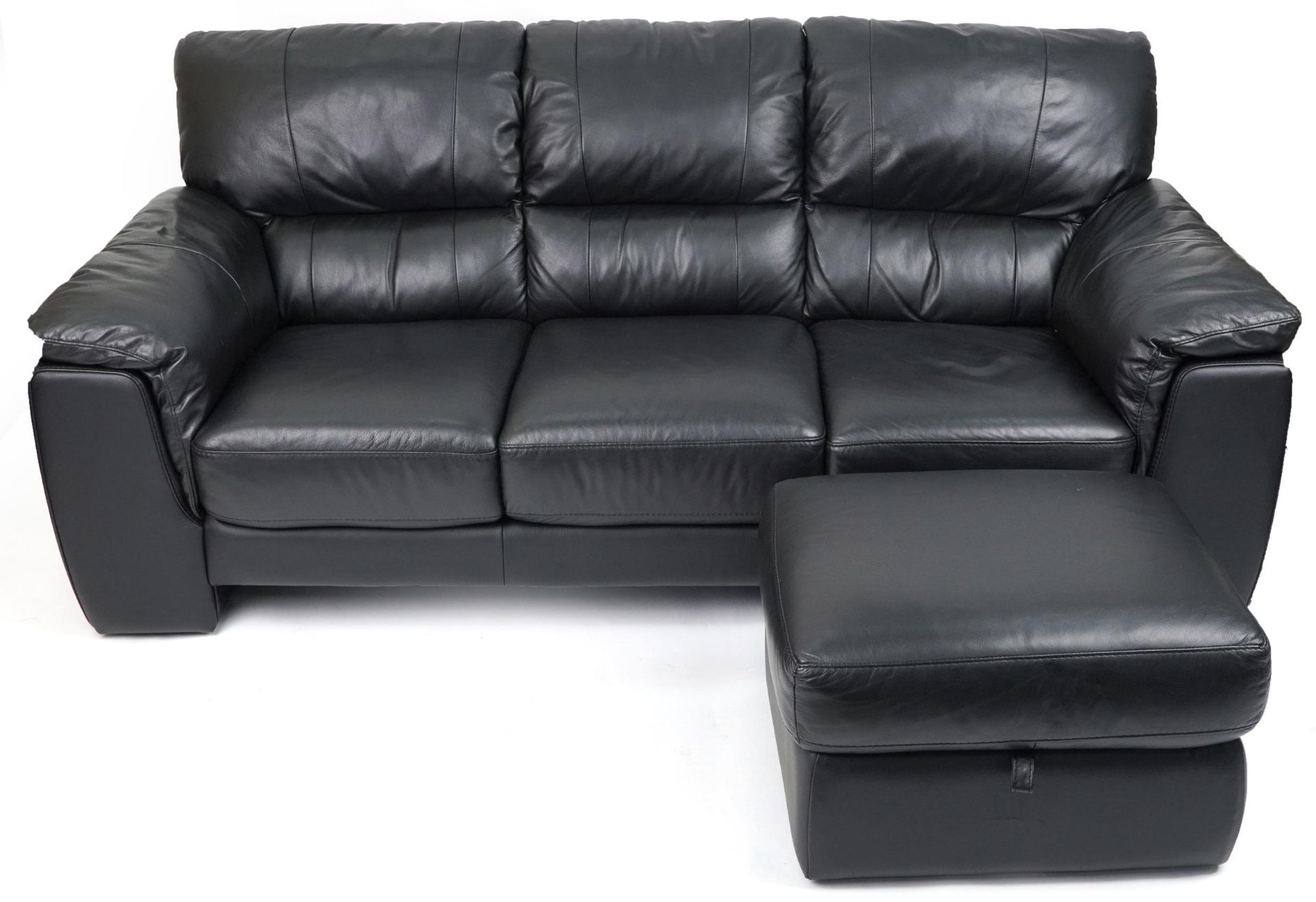 Contemporary three seater settee with black leather upholstery and footstool, the settee 90cm H x