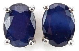 Pair of silver sapphire stud earrings, each 8mm high, total 2.1g