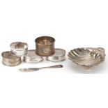 Edwardian and later silver objects comprising five napkin rings, butter knife and shell shaped