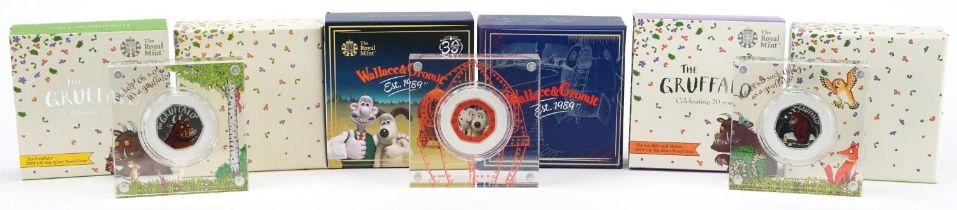 Three Wallace & Gromit and The Gruffalo silver proof fifty pence pieces by The Royal Mint, housed in