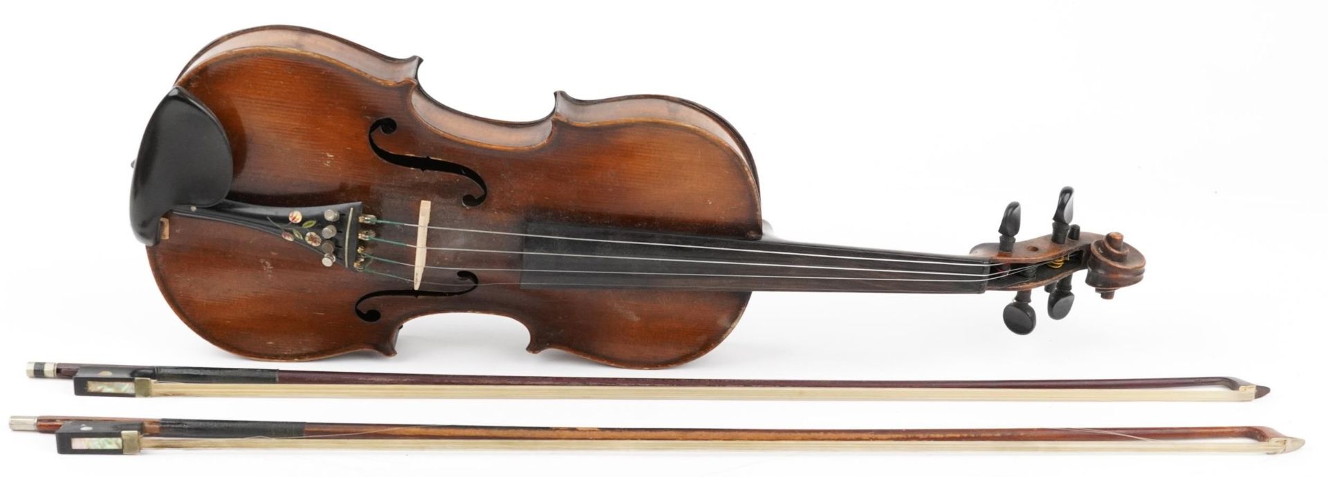 Old wooden violin with two bows housed in a fitted Reliance protective travel case, the violin