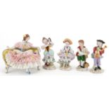 German porcelain comprising four Dresden figurines and a lace figurine in the form of a female on
