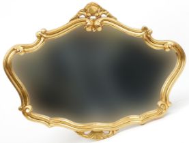 Ornate gilt framed wall mirror with C scrolls, 90cm x 71cm