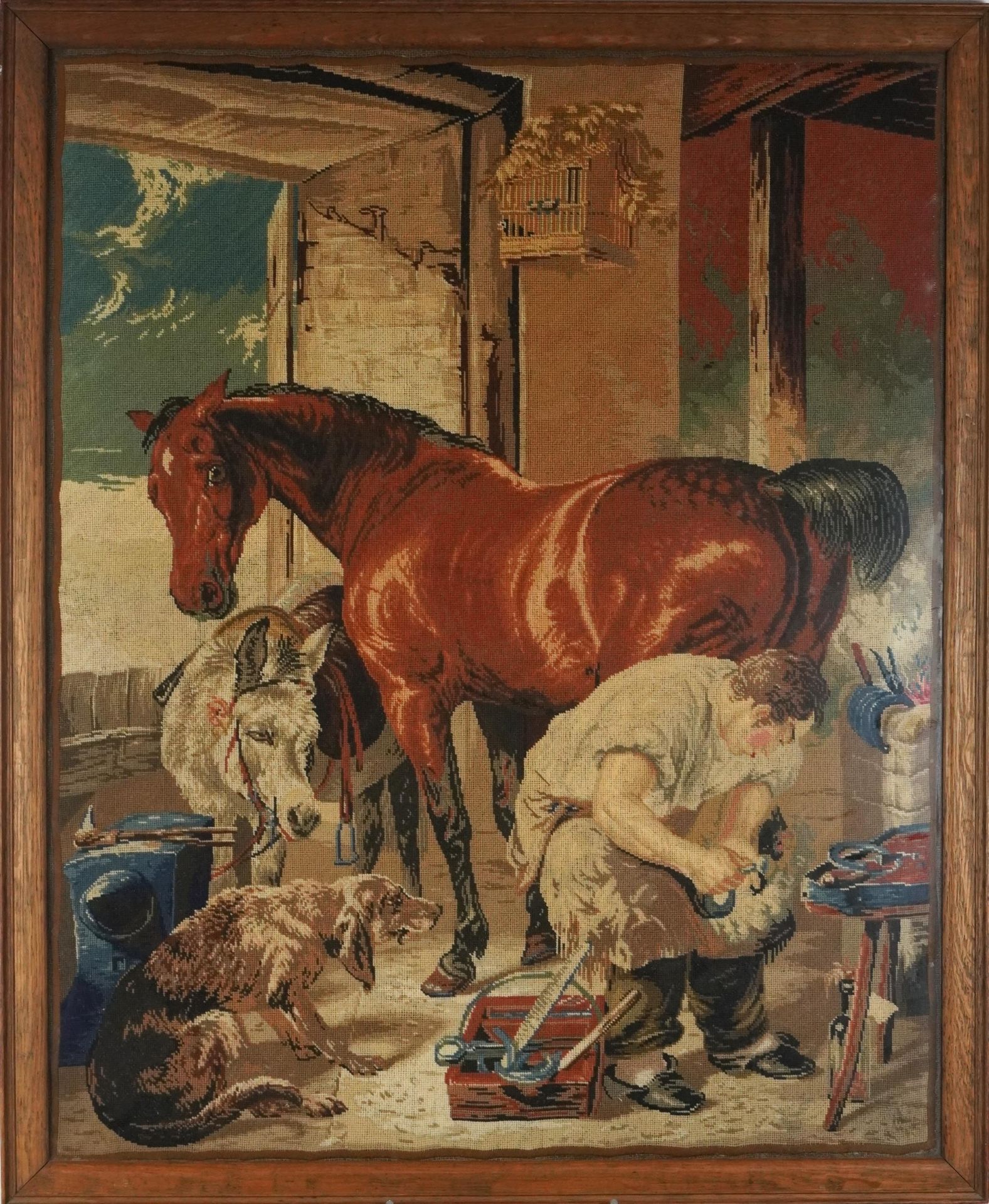 Farrier shoeing a horse with donkey and gundog, 19th century needlework tapestry, framed and glazed, - Image 2 of 3