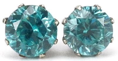 Pair of white metal blue topaz stud earrings, each approximately 6.70mm in diameter, total 2.0g