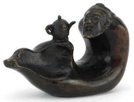 Chinese patinated bronze ingot in the form of a mythical figure and teapot, four figure character