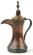 Antique Omani copper and brass dallah coffee pot with foliate engraved bands, 23cm high