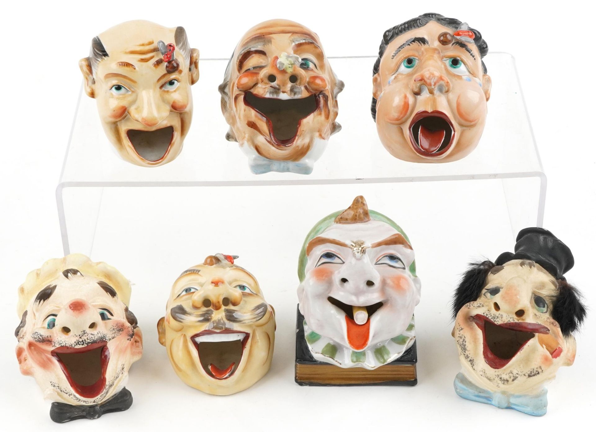 Seven early 20th century smoking interest Japanese porcelain ashtrays in the form of comical