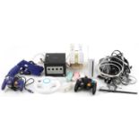 Nintendo Wii games console with controllers and accessories and a Nintendo Game Cube games console