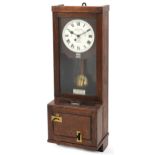 Gledhill-Brook Time Recorders patent oak clocking in machine having circular dial with Roman