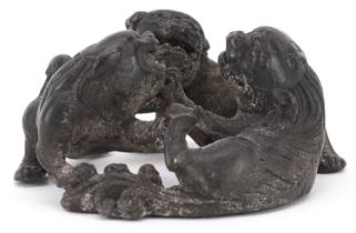 Chinese patinated bronze of three mythical animals, 6cm in diameter