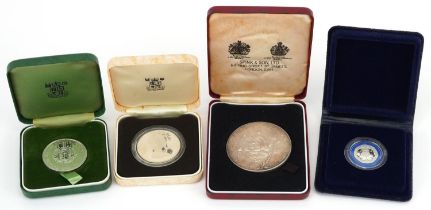 Silver proof coins and medals housed in fitted cases including medal commemorating Queen Elizabeth