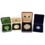 Silver proof coins and medals housed in fitted cases including medal commemorating Queen Elizabeth