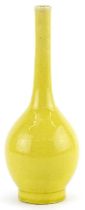 Chinese porcelain long neck bottle vase having a yellow glaze, 19cm high