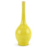 Chinese porcelain long neck bottle vase having a yellow glaze, 19cm high