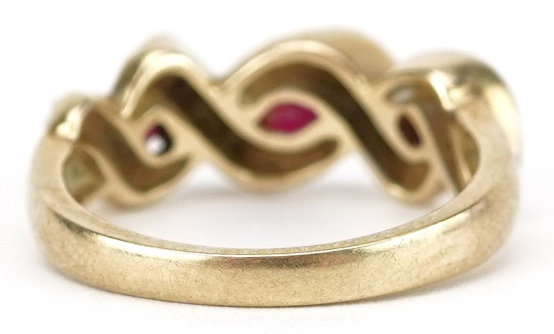 9ct gold diamond and ruby crossover ring, total diamond weight approximately 0.10 carat, the largest - Image 2 of 5