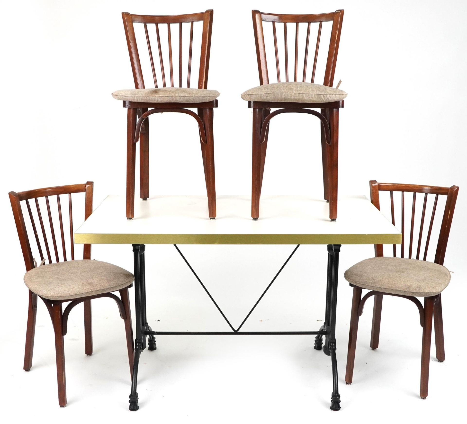 Contemporary rectangular bistro or dining table with four mahogany chairs with cushioned seats,