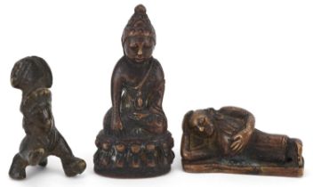 Three Chinese and Asian patinated bronze figures including an example of seated Buddha, the