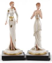 Pair of Italian porcelain figurines of females raised on silvered and ebonised stepped square bases,