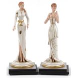 Pair of Italian porcelain figurines of females raised on silvered and ebonised stepped square bases,