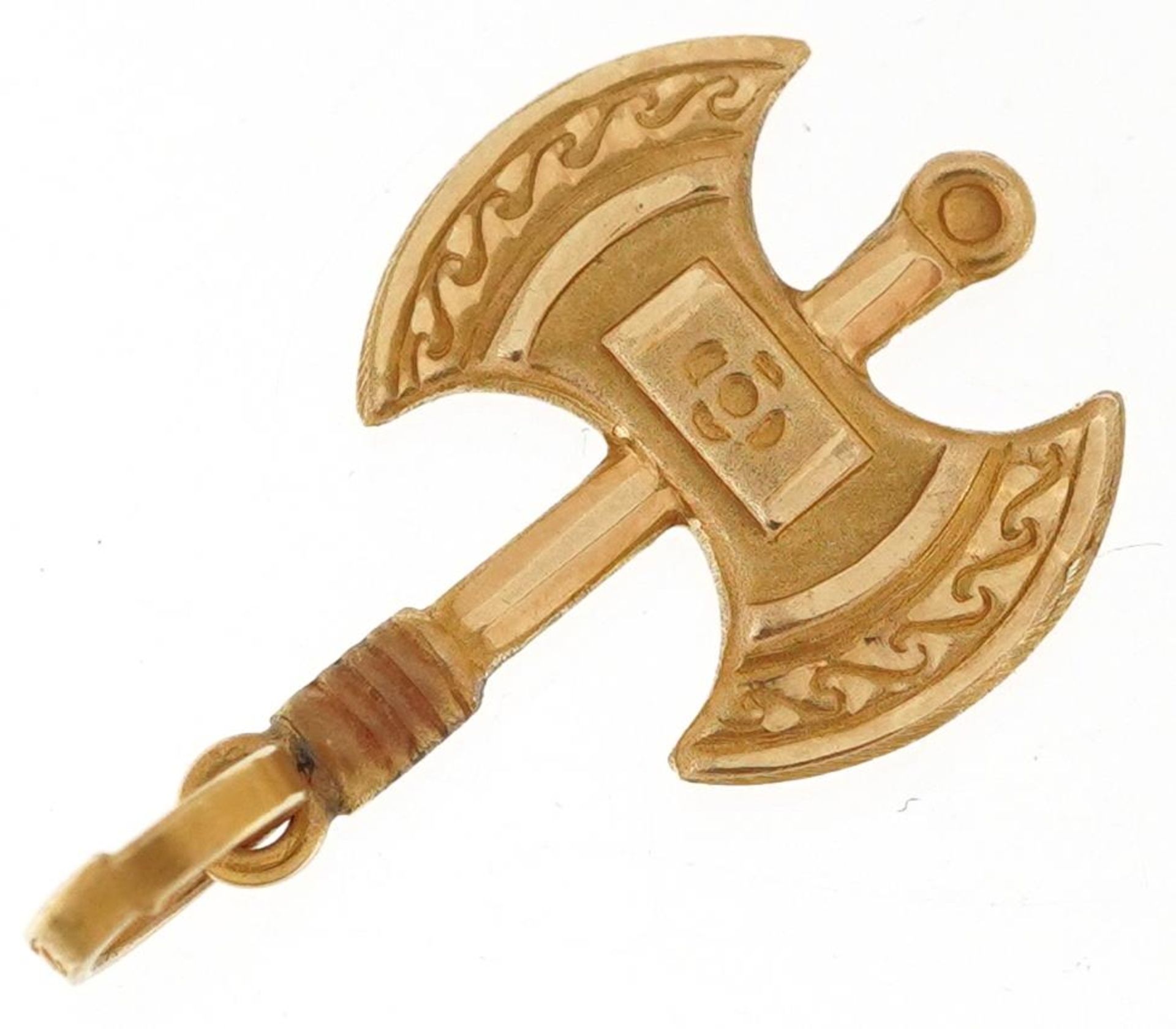 High carat gold charm in the form of a Viking axe, tests as 18ct+ gold, indistinct mark to the - Image 2 of 3