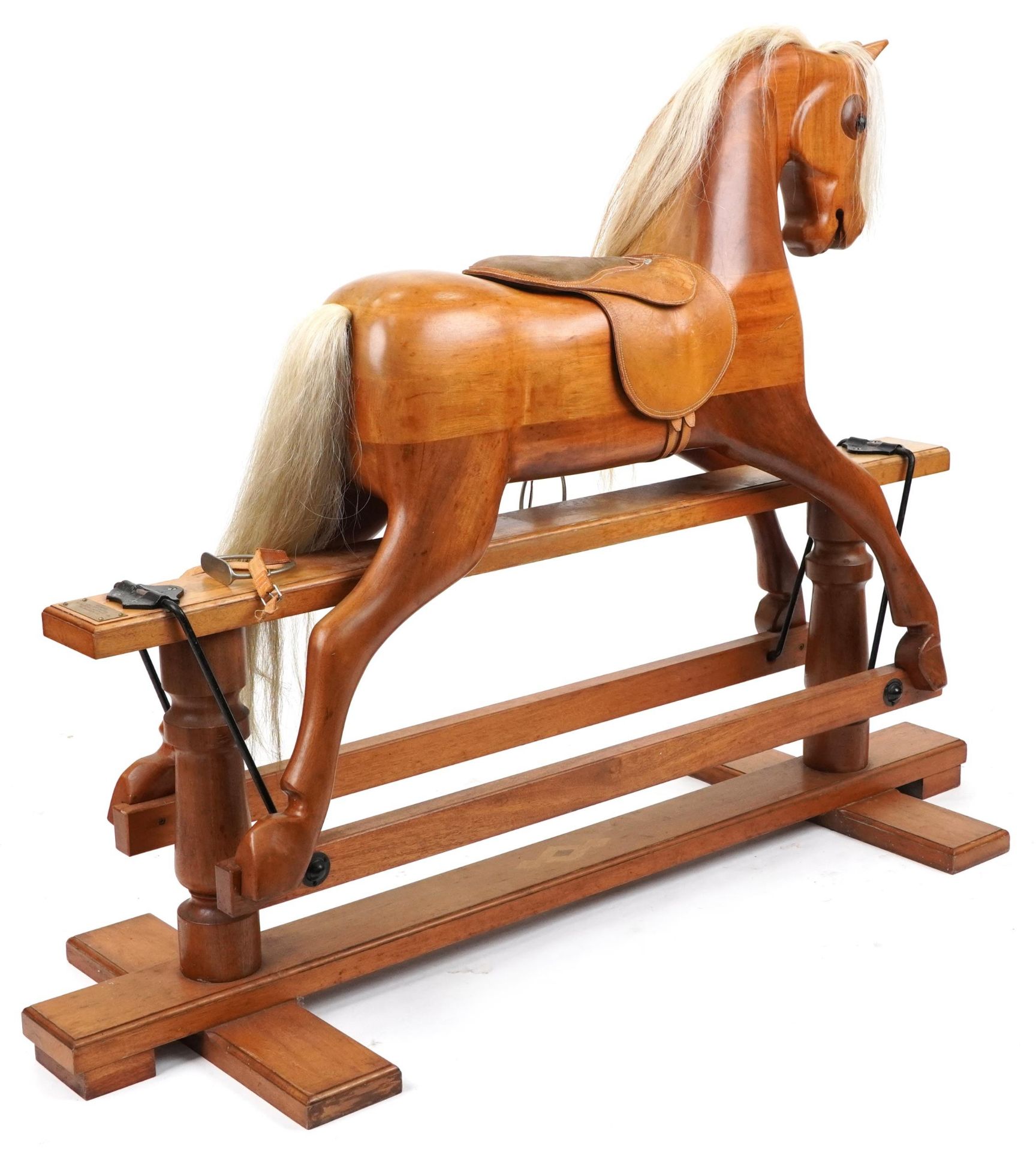 Large carved hardwood rocking horse with leather saddle on hardwood stand having brass plaque - Image 2 of 3