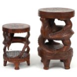 Two Chinese carved hardwood dragon design occasional tables, the largest 62cm high x 39cm in