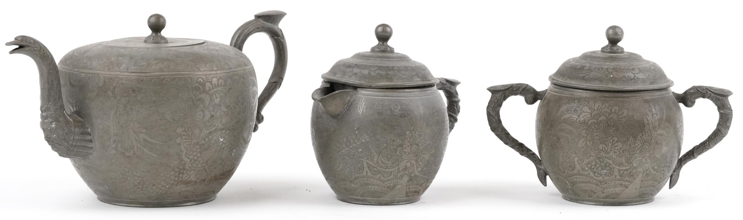 Chinese Swatow Kut Hing pewter three piece tea set comprising teapot, lidded milk jug and lidded